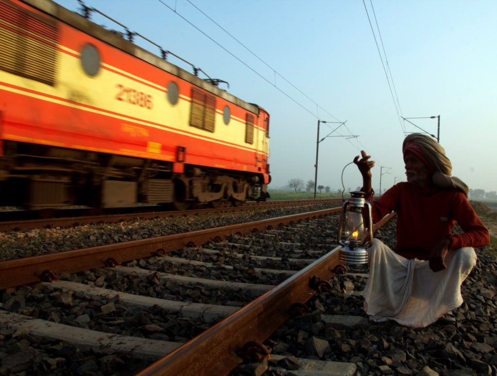 An old man with a lantern in Dharnai village